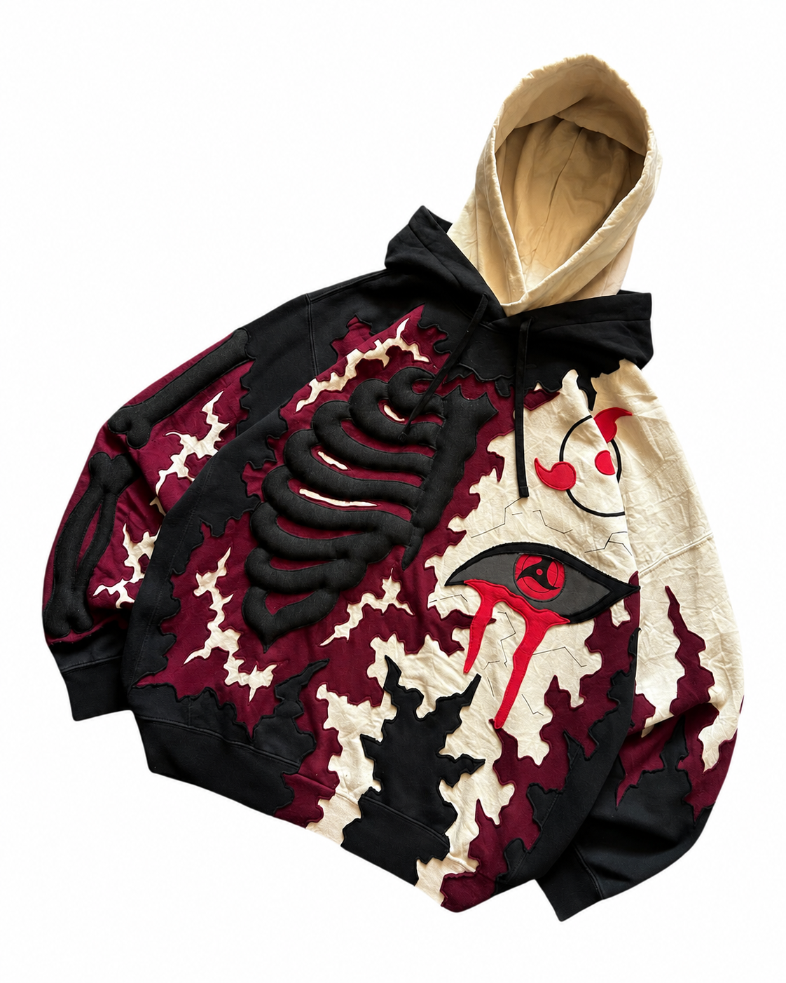 Angled flat lay of Noctra Crimson Eclipse premium oversized hoodie