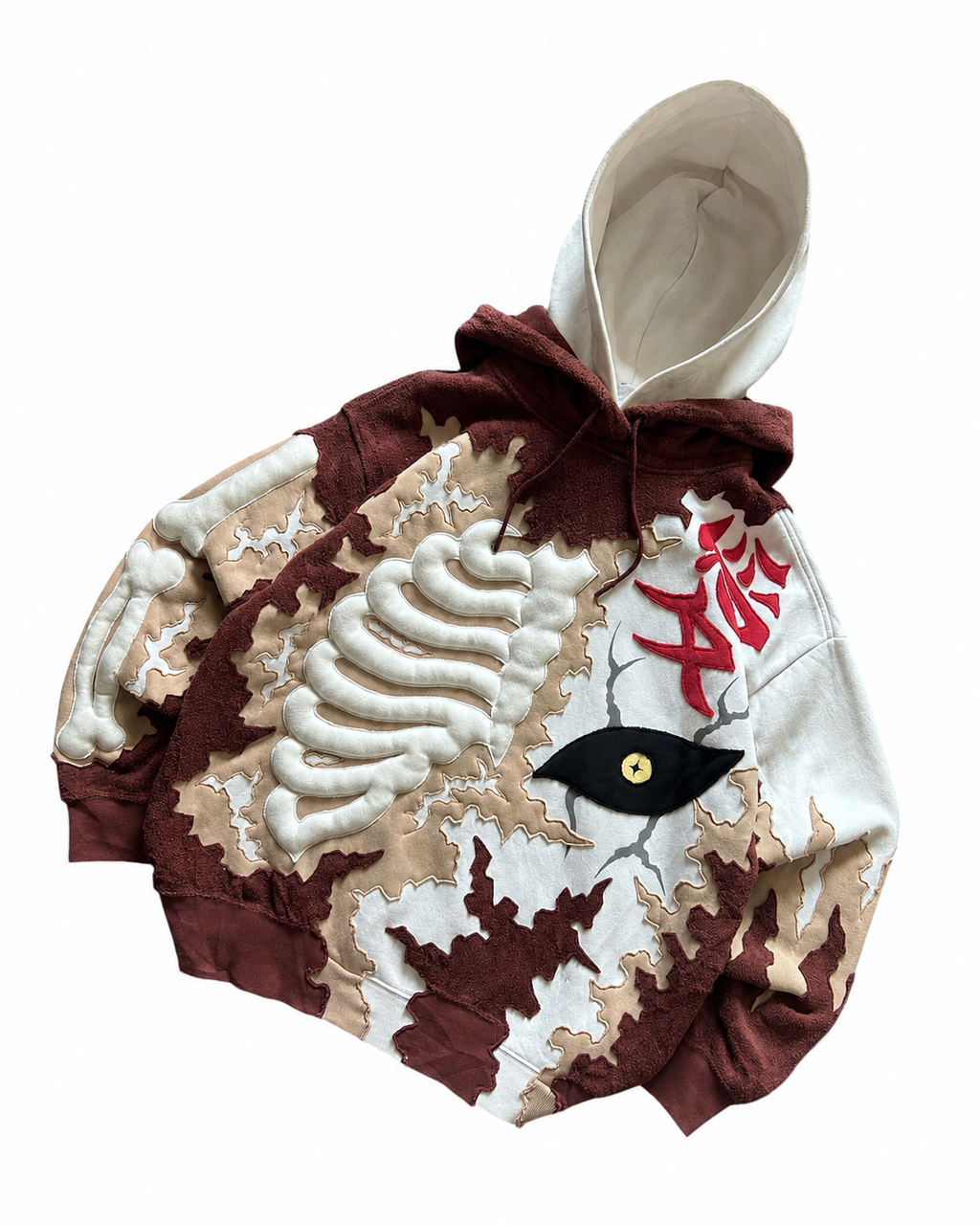 Angled flat lay of Noctra Ivory Rift oversized hoodie