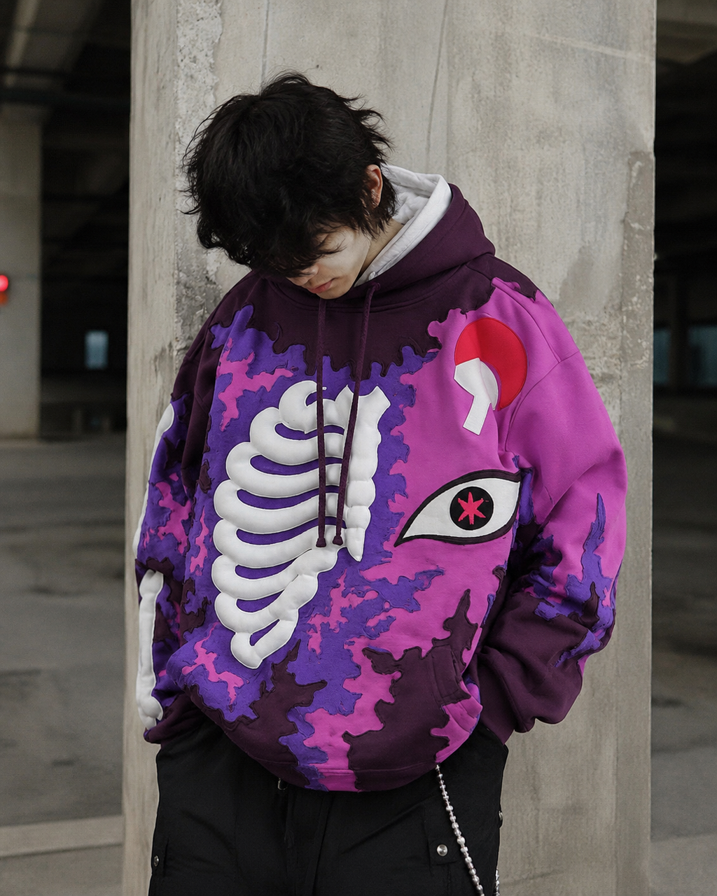 Model wearing Noctra Violet Rift purple skeleton streetwear hoodie