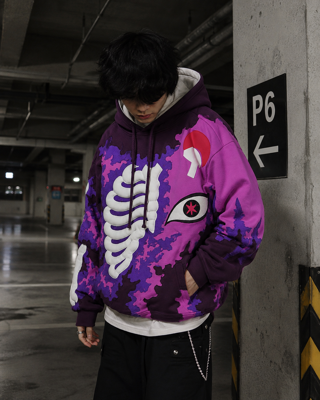 Purple oversized skeleton hoodie streetwear outfit on model